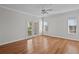 Spacious bedroom featuring hardwood floors and access to balcony at 613 Casabella Cir, Tampa, FL 33609