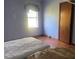 Bedroom with wood floors and window at 6658 Williams Rd, Seffner, FL 33584