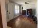 Living room featuring hardwood floors and a vintage dresser at 6658 Williams Rd, Seffner, FL 33584
