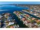 Waterfront neighborhood with boat docks and canals, and a view of the bay in the background at 1940 Hawaii Ne Ave, St Petersburg, FL 33703