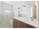 Modern bathroom with double sink vanity, updated fixtures, and glass shower at 1940 Hawaii Ne Ave, St Petersburg, FL 33703
