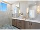 Modern bathroom with a glass shower, double sinks, and elegant fixtures at 1940 Hawaii Ne Ave, St Petersburg, FL 33703