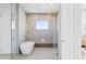 Spa-like bathroom with a glass-enclosed shower and modern soaking tub creating a luxurious retreat at 1940 Hawaii Ne Ave, St Petersburg, FL 33703