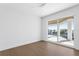 Bright, airy bedroom features sliding door access to an outdoor balcony at 1940 Hawaii Ne Ave, St Petersburg, FL 33703