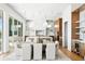 Elegant dining area with modern lighting, an open layout and a peek into the modern kitchen at 1940 Hawaii Ne Ave, St Petersburg, FL 33703