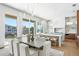 Bright dining area with modern chandeliers and a seamless flow to an open and modern kitchen at 1940 Hawaii Ne Ave, St Petersburg, FL 33703