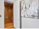 Interior elevator with wood paneled walls, and a contemporary art piece outside of the elevator at 1940 Hawaii Ne Ave, St Petersburg, FL 33703