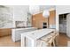 Spacious kitchen featuring double islands, breakfast bar seating, and top-of-the-line appliances at 1940 Hawaii Ne Ave, St Petersburg, FL 33703