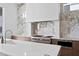 Modern kitchen featuring marble backsplash, stainless steel appliances, and ample counter space at 1940 Hawaii Ne Ave, St Petersburg, FL 33703