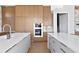 Gourmet kitchen with double islands, custom cabinetry, stainless steel appliances, and modern lighting at 1940 Hawaii Ne Ave, St Petersburg, FL 33703