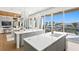 Bright, open kitchen with an island, breakfast bar, and scenic water views at 1940 Hawaii Ne Ave, St Petersburg, FL 33703