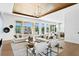 Bright and airy living room with stylish furnishings, wood ceiling, and expansive water views at 1940 Hawaii Ne Ave, St Petersburg, FL 33703