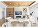 Elegant living room showcasing a fireplace, built-in shelving, and natural light with neutral tones at 1940 Hawaii Ne Ave, St Petersburg, FL 33703