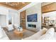 Beautifully staged living room featuring a fireplace, modern furniture, and bright natural light at 1940 Hawaii Ne Ave, St Petersburg, FL 33703