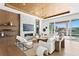 Modern living room featuring a fireplace, elegant decor, wood ceiling and water views at 1940 Hawaii Ne Ave, St Petersburg, FL 33703