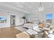 Spacious main bedroom features bright, neutral tones, a tray ceiling, and elegant, modern furnishings at 1940 Hawaii Ne Ave, St Petersburg, FL 33703