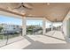 Covered outdoor patio featuring ceiling fans and beautiful water views of the surrounding neighborhood at 1940 Hawaii Ne Ave, St Petersburg, FL 33703
