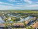 Wide aerial showcasing waterfront property, community, and bridge at 6321 Newtown Cir # 21B4, Tampa, FL 33615
