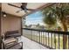 Private balcony overlooking the water with seating for relaxing at 6321 Newtown Cir # 21B4, Tampa, FL 33615