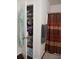 Linen closet and bathroom with shower and curtain at 10319 Boyette Creek Blvd, Riverview, FL 33569
