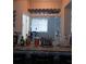 Detailed view of a home bar with various liquors and glassware at 10319 Boyette Creek Blvd, Riverview, FL 33569