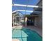 Relaxing pool area with patio and screened enclosure, perfect for outdoor enjoyment at 10319 Boyette Creek Blvd, Riverview, FL 33569