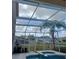 Enclosed pool and patio area with screened enclosure, offering a private outdoor space at 10319 Boyette Creek Blvd, Riverview, FL 33569