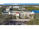 Aerial view of the building, parking, and surrounding area at 11485 Oakhurst Rd # A203, Largo, FL 33774