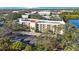 Aerial view of building with parking and lake view at 11485 Oakhurst Rd # A203, Largo, FL 33774