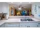 Kitchen with breakfast bar overlooking living room at 11485 Oakhurst Rd # A203, Largo, FL 33774
