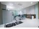 Kitchen features white cabinets and stainless steel appliances at 11485 Oakhurst Rd # A203, Largo, FL 33774