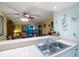 Kitchen features a pass-through to dining area at 11485 Oakhurst Rd # A203, Largo, FL 33774