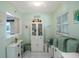 White kitchen with built-in shelving and pantry at 11485 Oakhurst Rd # A203, Largo, FL 33774