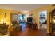 Living room with view of bedroom and access to a patio at 11485 Oakhurst Rd # A203, Largo, FL 33774