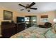 Bright bedroom with king-size bed and access to a private balcony at 11485 Oakhurst Rd # A203, Largo, FL 33774