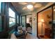 Bright screened balcony boasts comfy seating and access to bedroom at 11485 Oakhurst Rd # A203, Largo, FL 33774