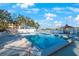 Inviting community pool with lake view and lush landscape at 11485 Oakhurst Rd # A203, Largo, FL 33774