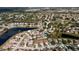 Beautiful aerial view of a neighborhood with many houses surrounding a lake at 12518 Midpointe Dr, Riverview, FL 33578