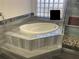 Relax in this oval soaking tub, adjacent to a walk-in shower at 1315 Cowart Rd, Plant City, FL 33567