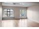 Bright living room with hardwood floors and built-in shelving at 1526 Oakwood St, Clearwater, FL 33755