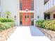 Building entrance with double doors and landscaping at 2612 Pearce Dr # 304, Clearwater, FL 33764