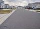 Quiet residential street with houses and parked cars at 3509 Maple Grove Way, Plant City, FL 33565