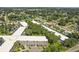 An apartment building's aerial view, highlighting its layout and landscaping at 4300 58Th N St # 1907, Kenneth City, FL 33709