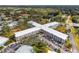 Aerial view of a large apartment building with ample parking at 4300 58Th N St # 1907, Kenneth City, FL 33709