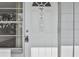 White apartment entrance door with window and keypad lock at 4300 58Th N St # 1907, Kenneth City, FL 33709
