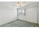Simple bedroom with carpet, window, and ceiling fan at 4300 58Th N St # 1907, Kenneth City, FL 33709