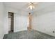 Spacious bedroom with carpet, ceiling fan, and large closet at 4300 58Th N St # 1907, Kenneth City, FL 33709