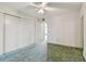 Simple bedroom with carpet, ceiling fan and ample closet space at 4300 58Th N St # 1907, Kenneth City, FL 33709