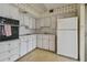 Efficient kitchen featuring white cabinets and built-in appliances at 4300 58Th N St # 1907, Kenneth City, FL 33709