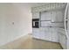 Simple kitchen with white cabinets and appliances at 4300 58Th N St # 1907, Kenneth City, FL 33709